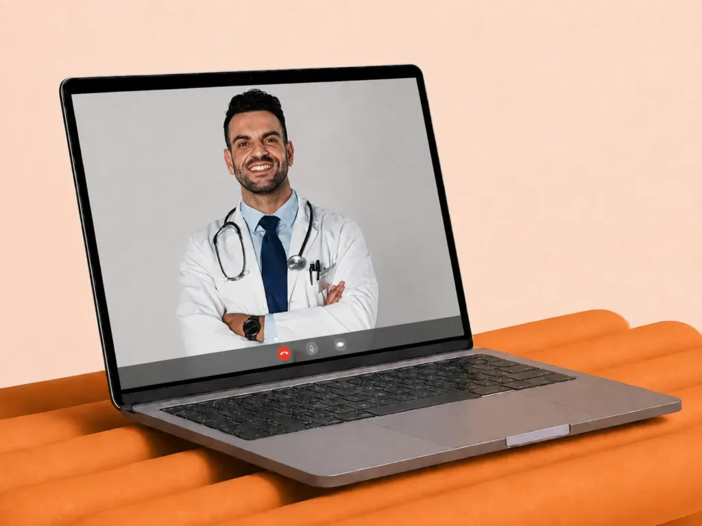Bearded physician in a white coat and stethoscope on a video telehealth call